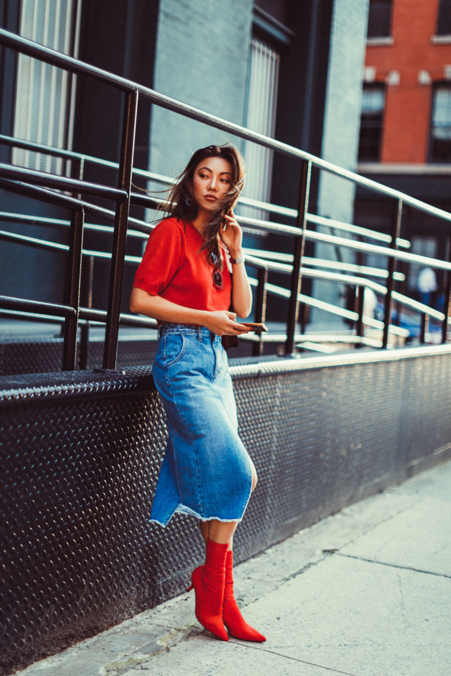 fashion blogger jessica wang shares thanksgiving day outfit ideas and wears a midi denim skirt with red boots and a red tee // Notjessfashion.com
