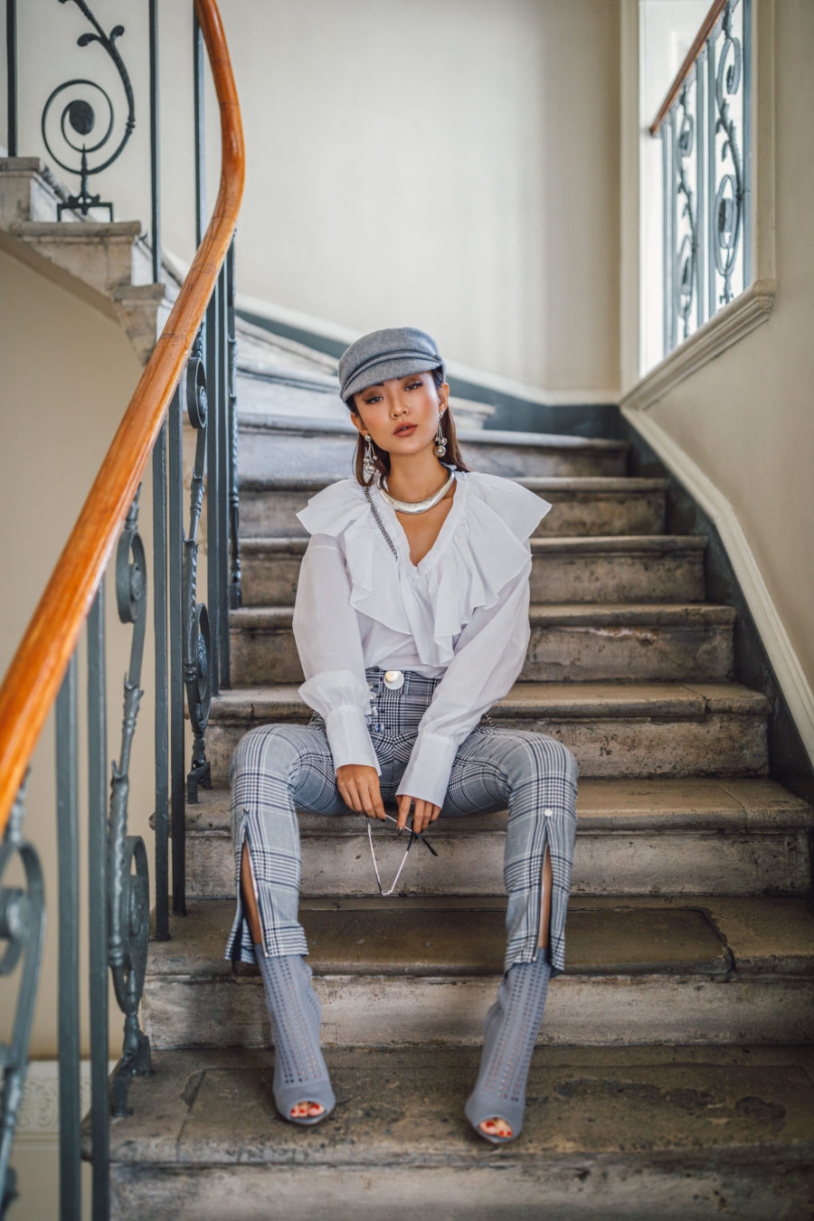 jessica wang wearing a white ruffle shirt, gray plaid pants, and peep toe ankle boots while sharing her favorite out of the box accessories to elevate your outfits // Jessica Wang - Notjessfashion.com