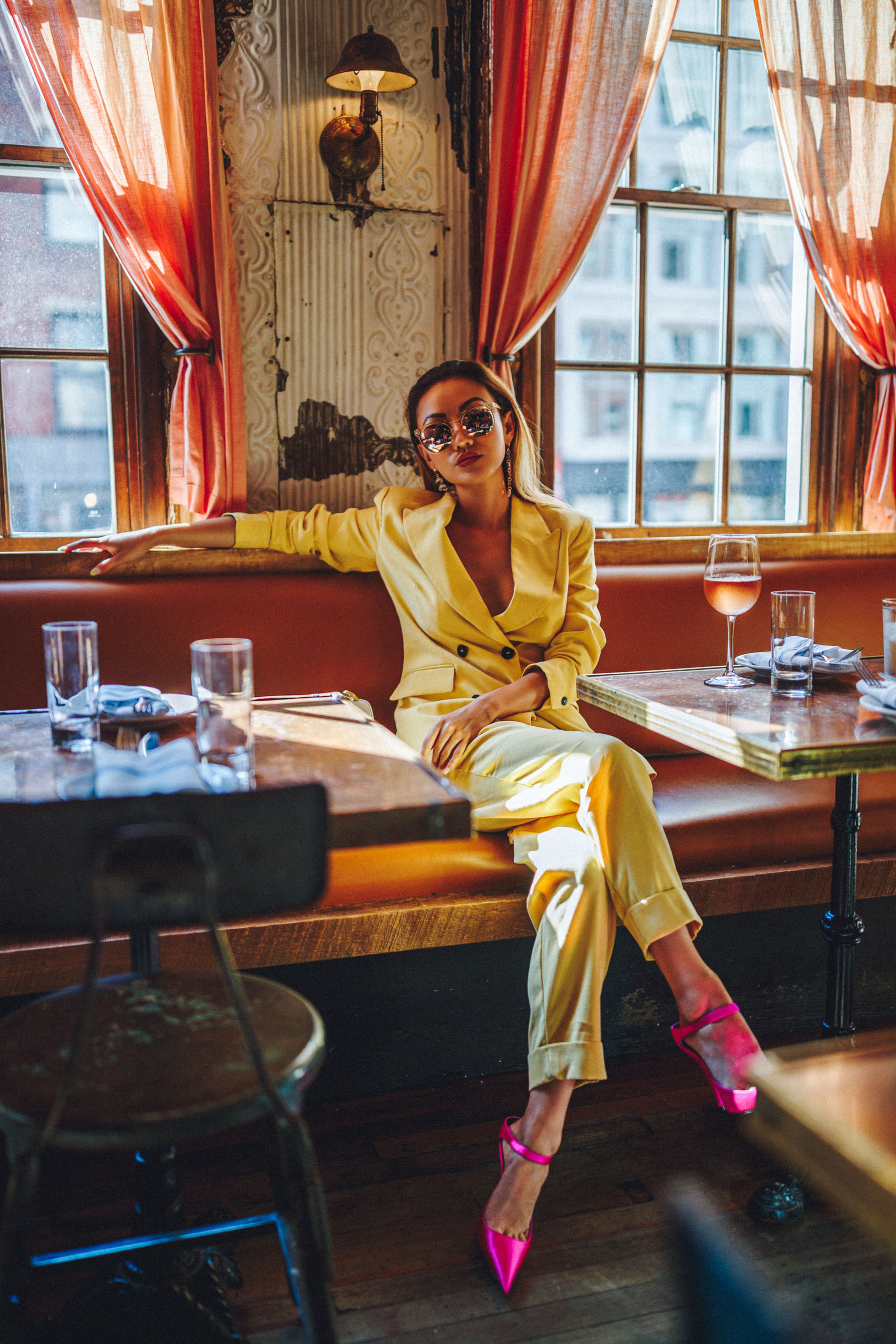 Essential Photography Tips for New Bloggers - yellow suit with pink heels // NotJessFashion.com // jessica wang, new york fashion blogger, asian blogger, fashion blogger street style, street style fashion, monochrome yellow, nyc cafe, round sunglasses, fashion blogger outfit