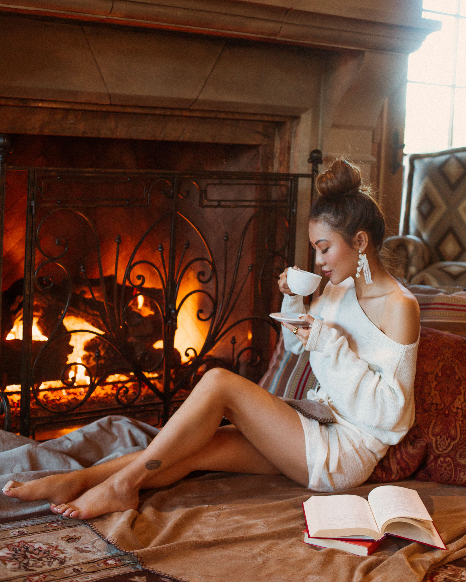 Make more time for yourself in the new year // Cozy white sweater by the fireplace // Notjessfashion.com
