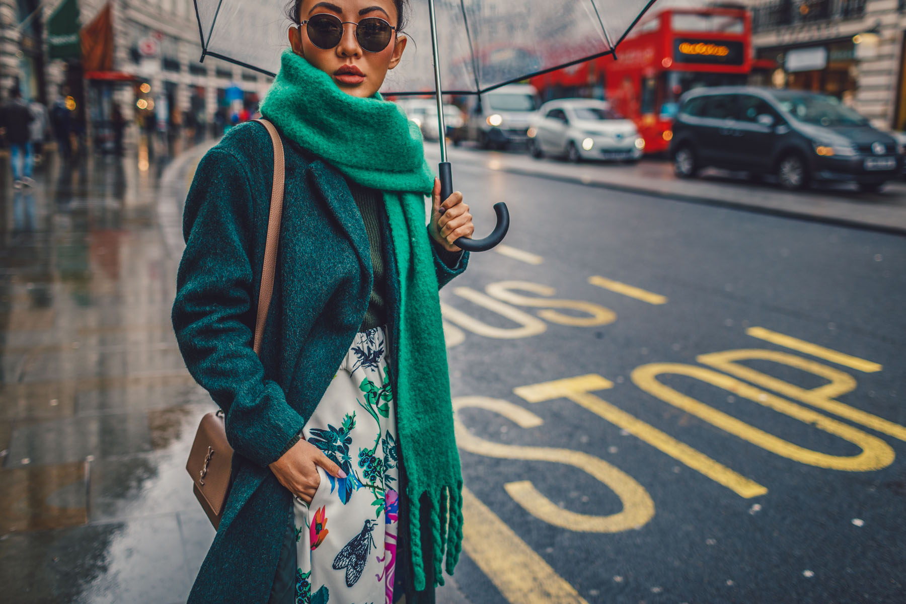 green floral skirt, green coat, dad sneakers, clear umbrella in london // Notjessfashion.com