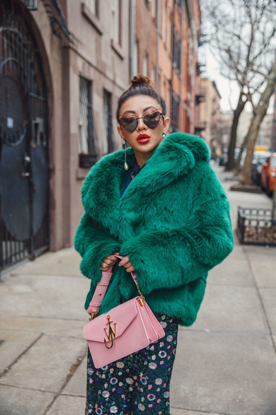 Jessica Wang wearing a green fur coat and an floral dress with a pink JW anderson shoulder bag and drop pearl earrings // Jessica Wang - Notjessfashion.com