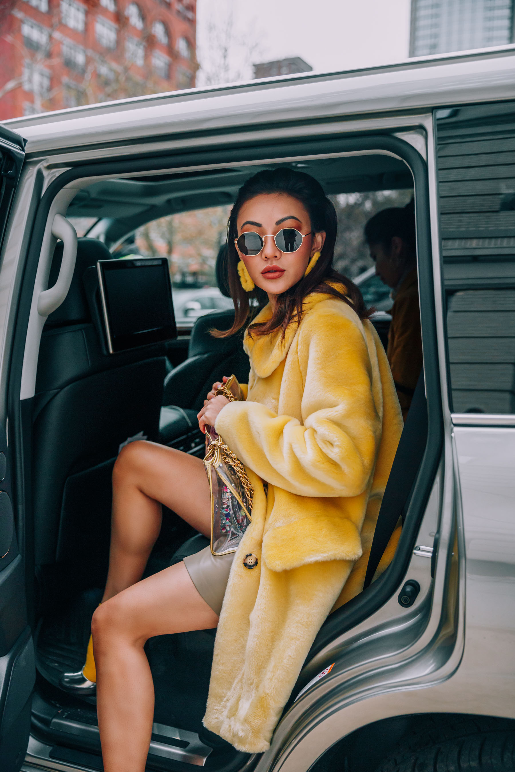 The Best Way to Get Around During NYFW // Notjessfashion.com // Yellow Fur Coat, Yellow Earrings, NYFW Street Style, Uber
