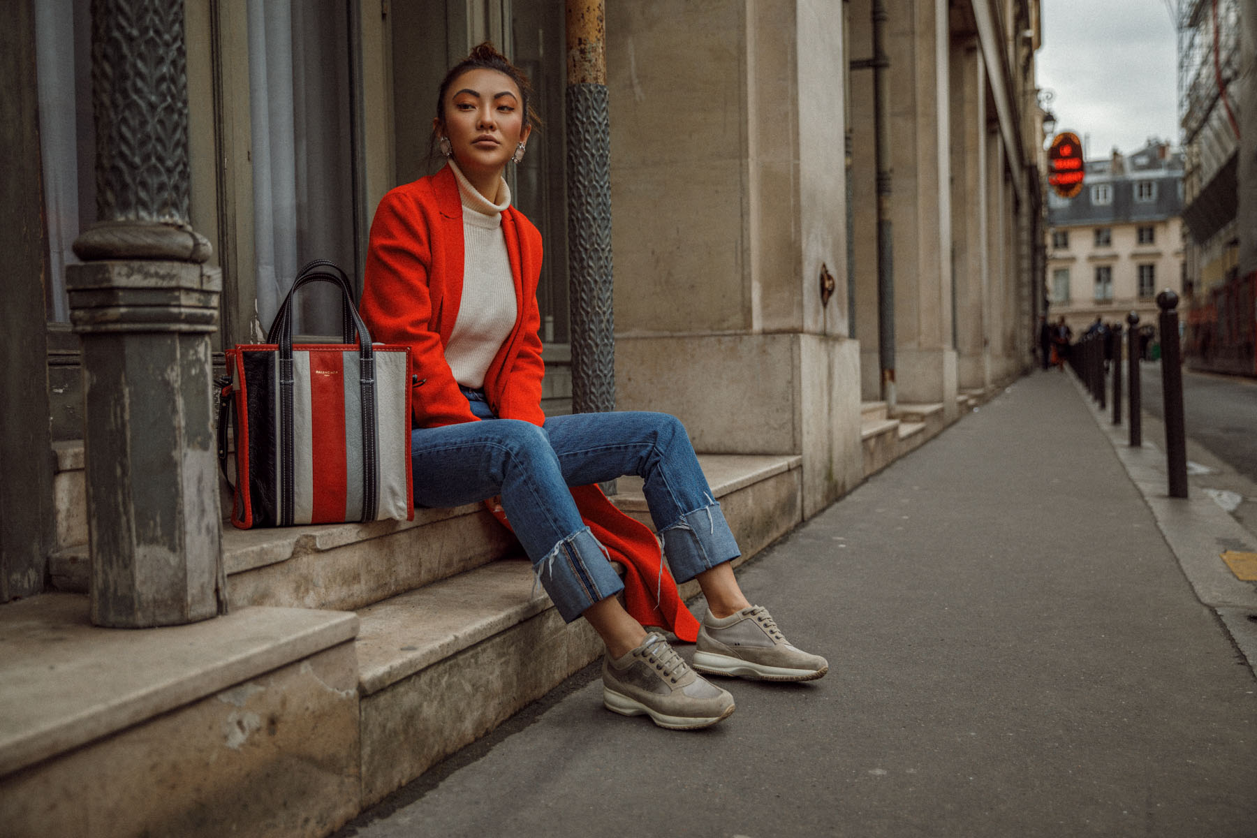 Winter Trends You Can Still Wear In Spring - Bright red coat, cuffed jeans, balenciaga bazar shopper, jessica wang in paris, pfw street style // Notjessfashion.com