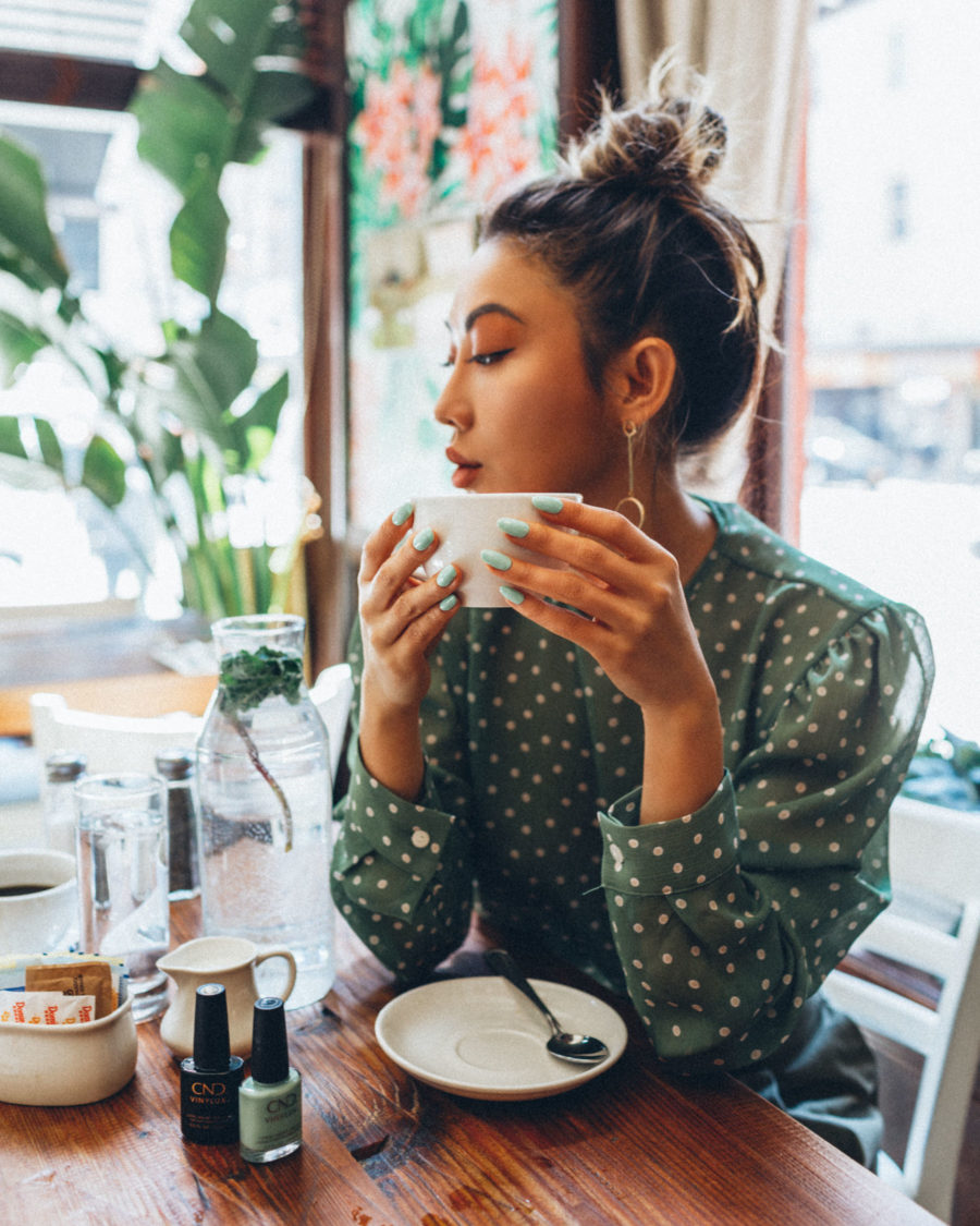 fashion blogger jessica wang drinking coffee in NYC cafe and sharing the best self-care apps // Jessica Wang - Notjessfashion.com