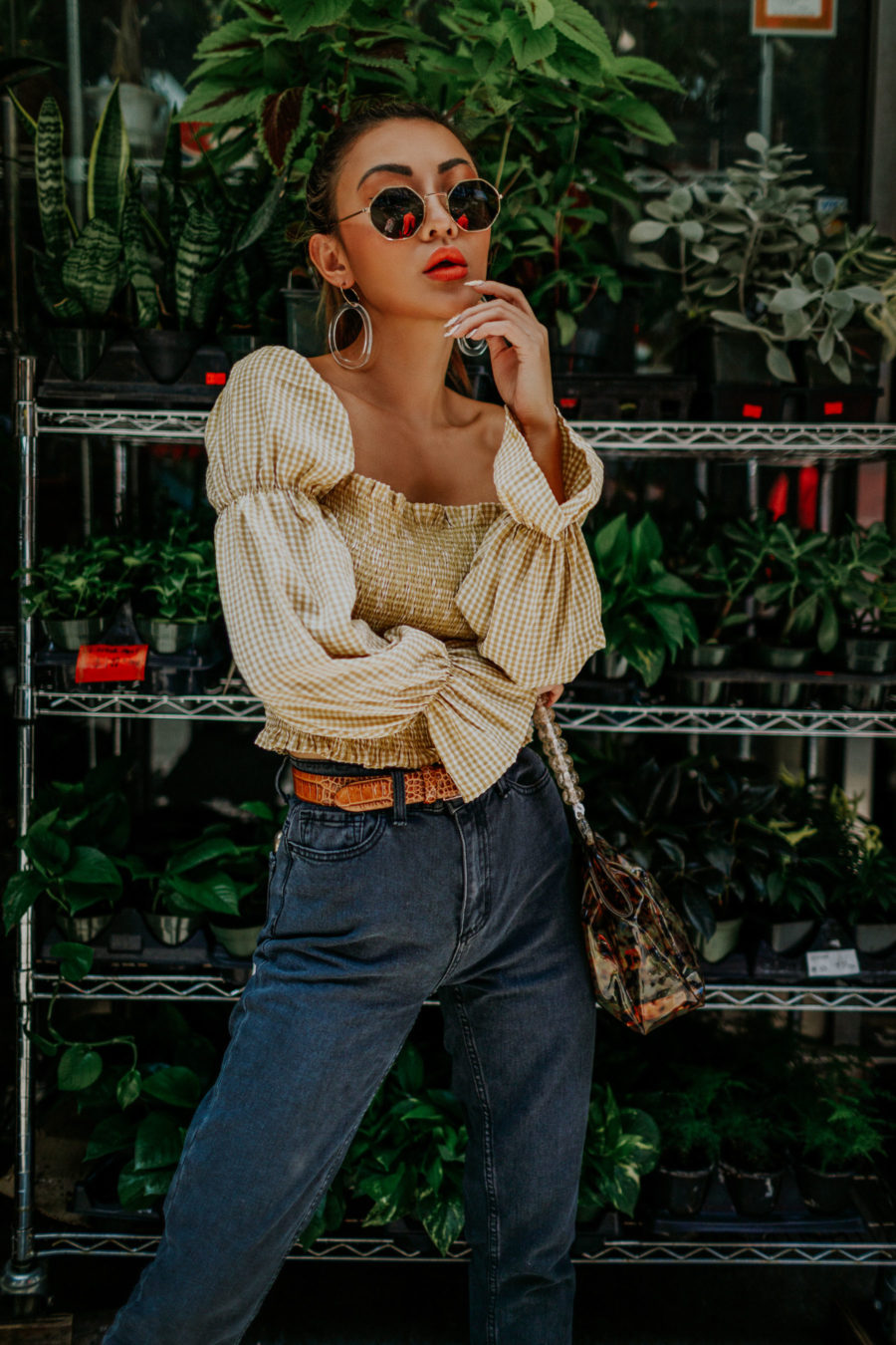 jessica wang wearing BDG Mom Jeans, smocked top, western belt, hexagonal sunglasses while sharing tips on sustainable fashion // Jessica Wang - Notjessfashion.com