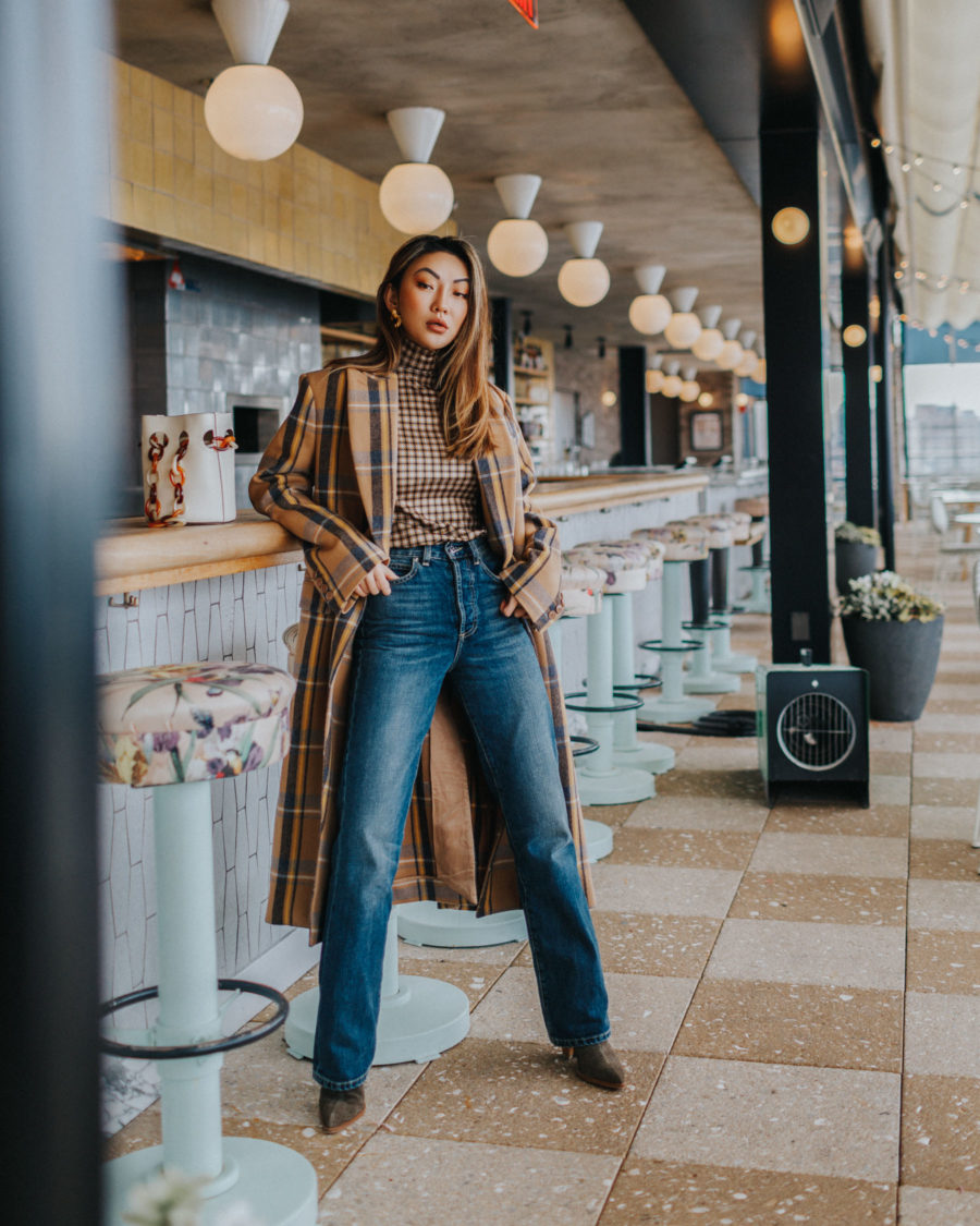 fashion blogger jessica wang wears a neutral plaid coat with long jeans and western boots // Notjessfashion.com