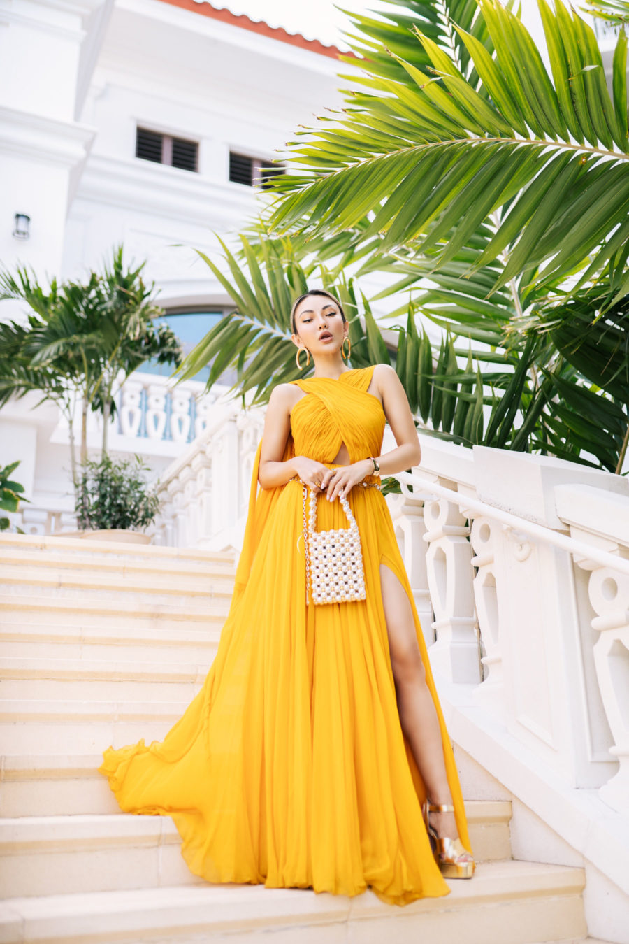 jessica wang wearing a yellow oscar de la renta cut out dress while sharing trendy summer dresses // Jessica Wang - Notjessfashion.com
