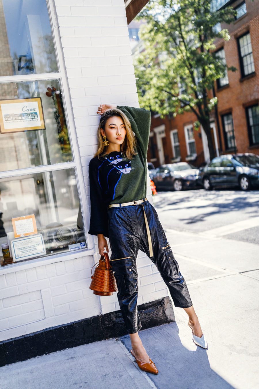 fashion blogger jessica wang wears cat sweater with leather pants and kalda mules sharing different ways to track your blog's growth in 2020 // Notjessfashion.com