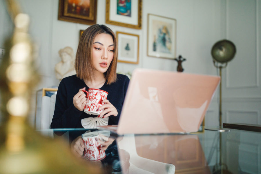 fashion blogger jessica wang wears bow tie sweater at the home office while sharing ways to achieve your financial goals in 2020 // Notjessfashion.com
