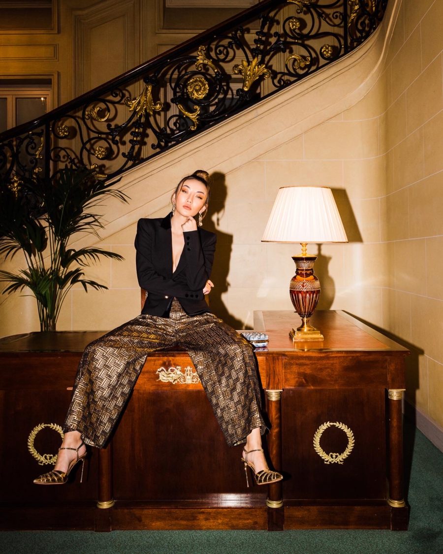 fashion blogger wears gold trousers and a blazer, sharing the must-read books of 2020 // Notjessfashion.com