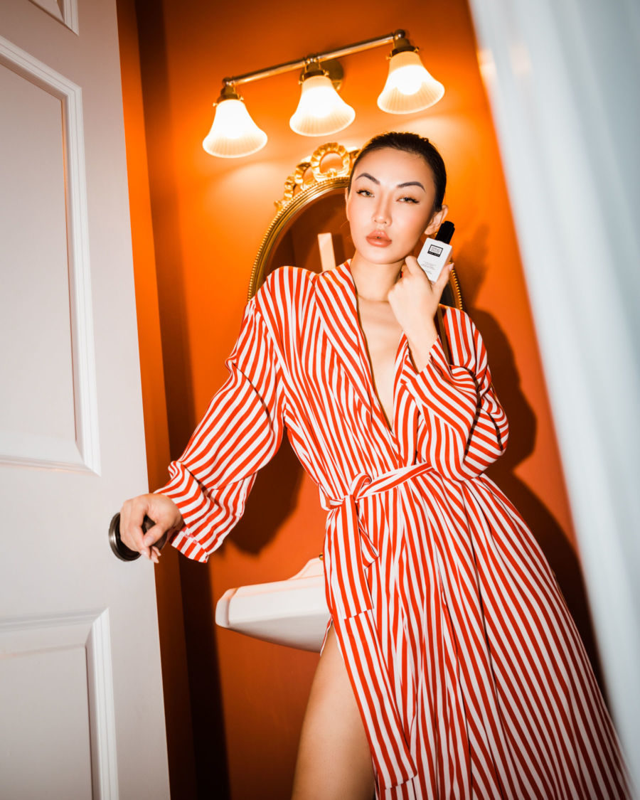 jessica wang wearing a red and white stripe wrap dress featuring a clean organic and natural beauty brand, erno laszlo, while sharing her favorite beauty buys from the Nordstrom Anniversary Sale 2021 // Jessica Wang - Notjessfashion.com // Jessica Wang Notjessfashion.com
