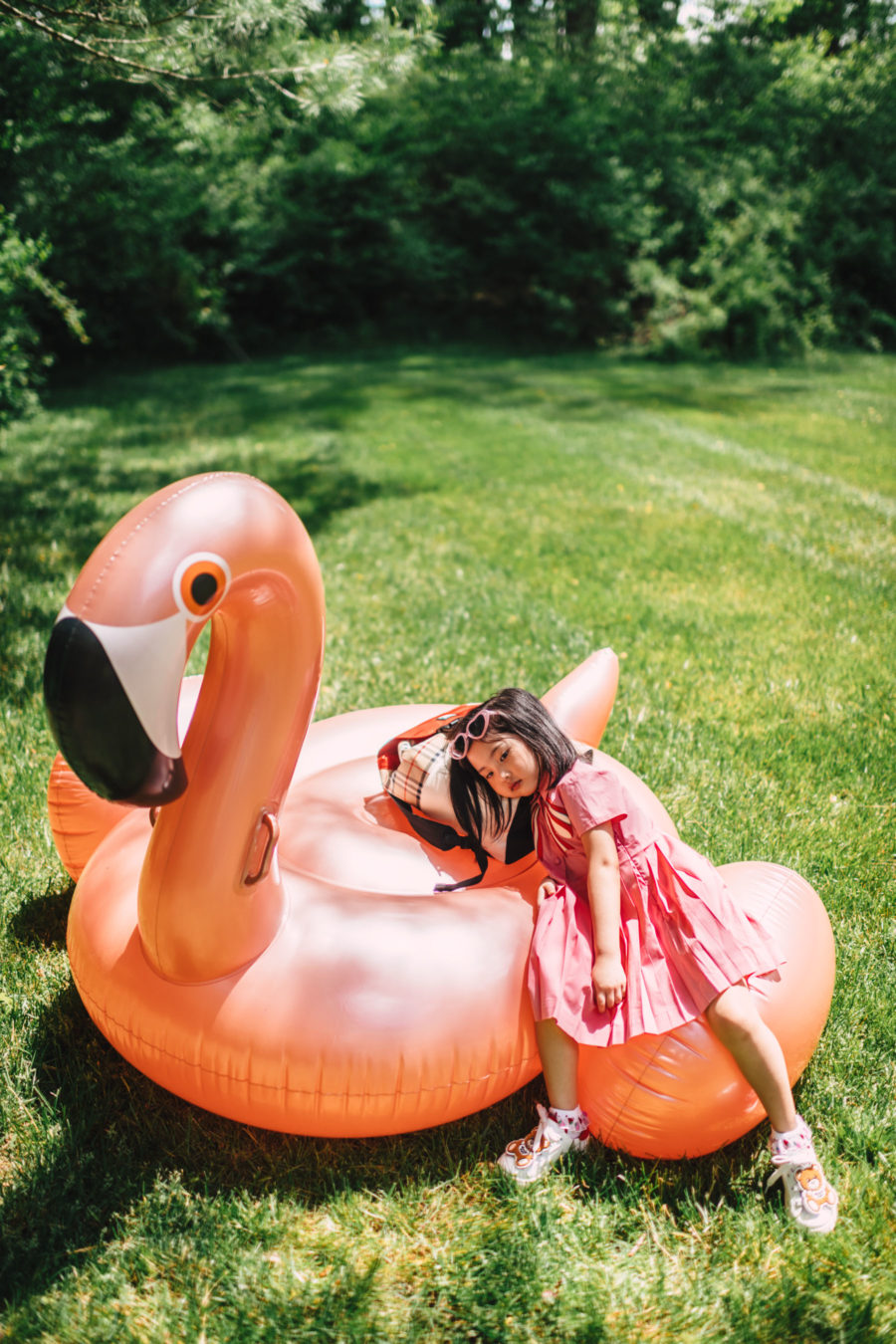 jessica wang's daughter wearing gucci dress on flamingo float // Jessica Wang - Notjessfashion.com