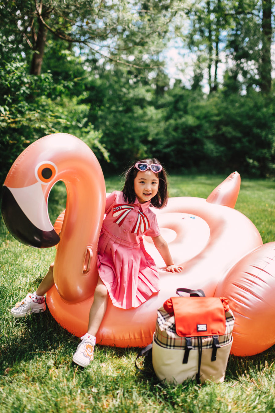 jessica wang's daughter wearing gucci dress on flamingo float // Jessica Wang - Notjessfashion.com