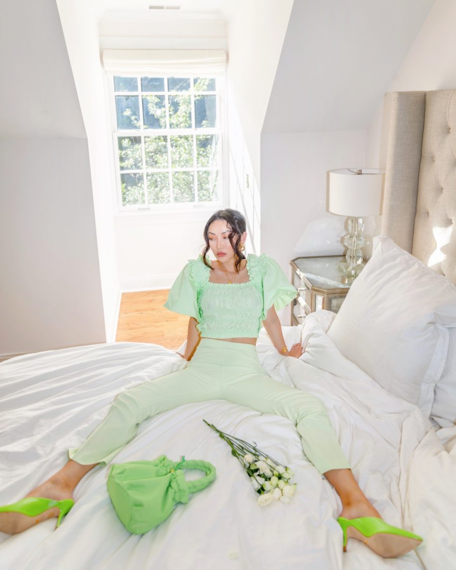 jessica wang wearing green outfit on bed sharing nordstrom anniversary sale home finds // Jessica Wang - Notjessfashion.com