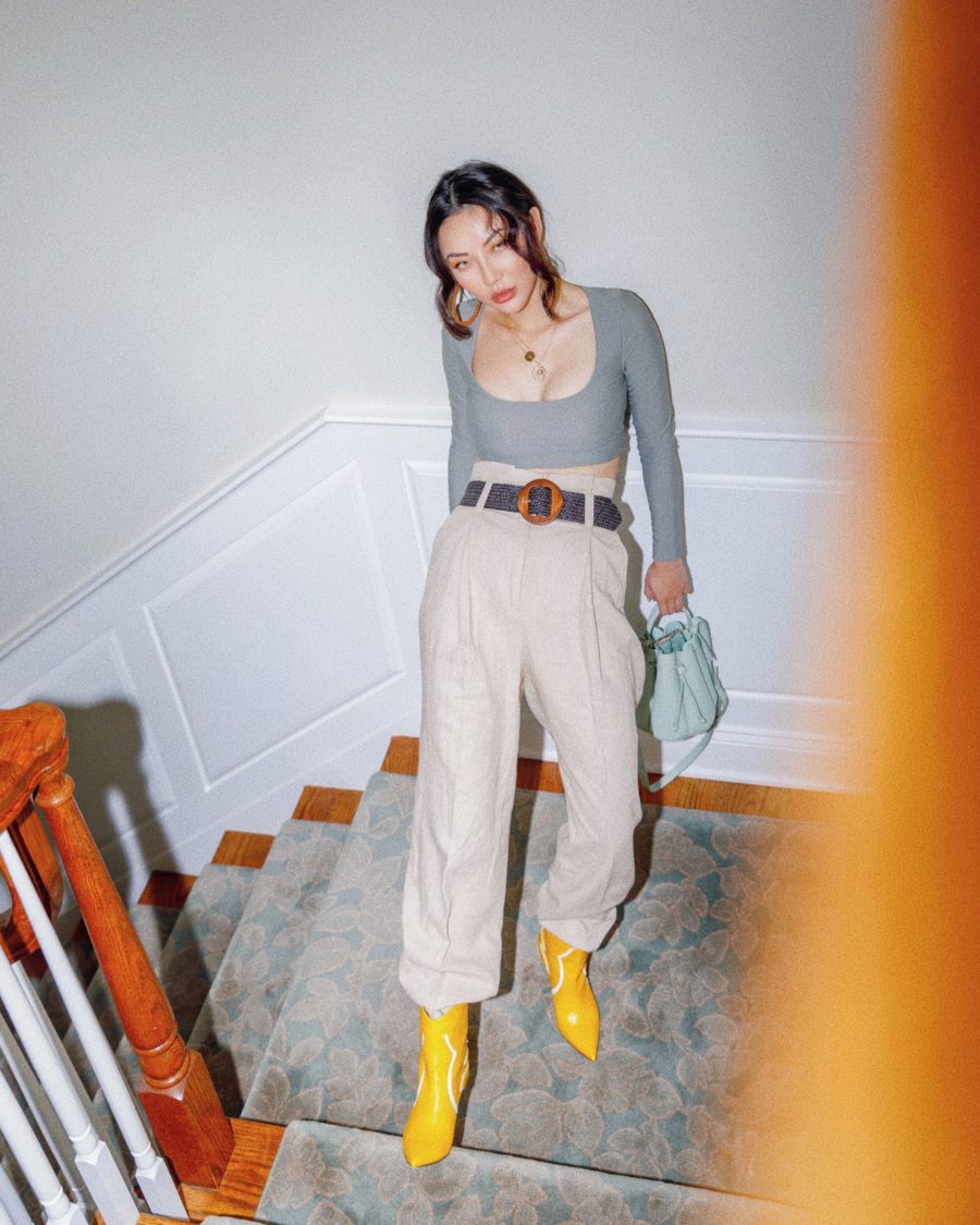 fashion blogger jessica wang at home wearing yellow boots and khaki trousers sharing the best iphone accessories for influencers // Jessica Wang - Notjessfashion.com