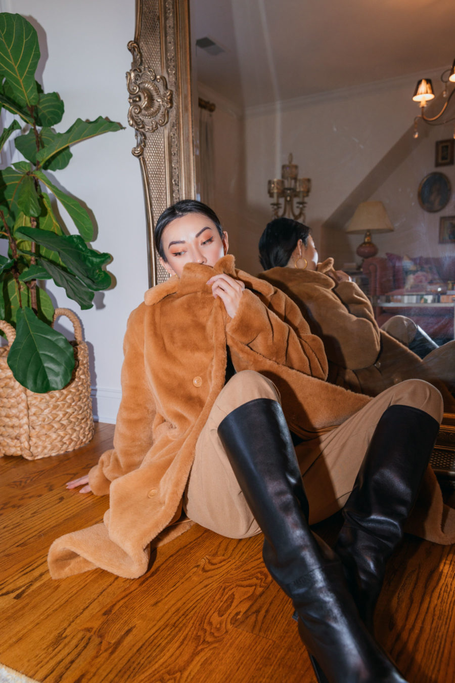 jessica wang wearing a faux fur coat in front of a large gold mirror while sharing trendy decor items for the home // Jessica Wang - Notjessfashion.com