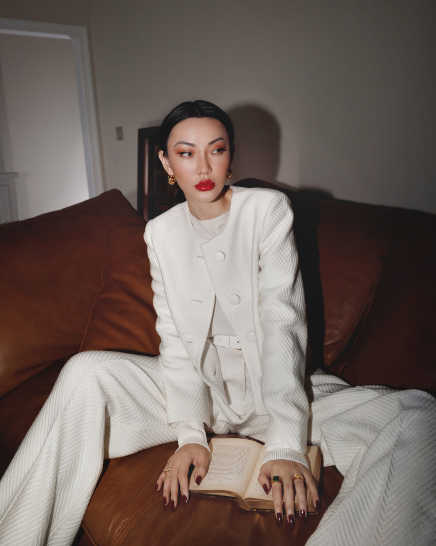 Jessica Wang wearing a white tailored suit - blazer and pants - with a white t shirt and merlot colored nail polish while sharing fall 2021 nail colors // Jessica Wang - Notjessfashion.com