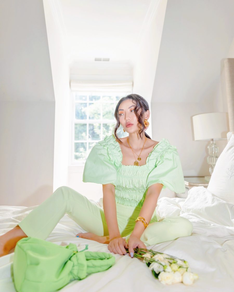 jessica wang wearing a green smocked puff sleeve top with high waist pants while sharing her on trend spring tops from amazon finds // Jessica Wang - Notjessfashion.com