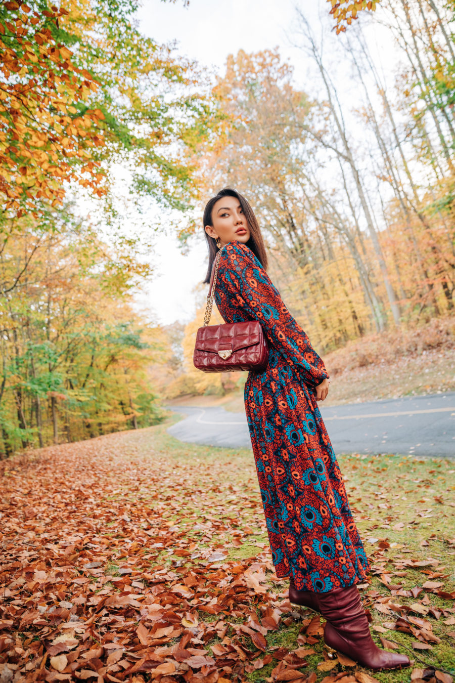 Jessica Wang wearing thanksgiving outfits featuring a dark floral maxi dress with boots // Jessica Wang - Notjessfashion.com