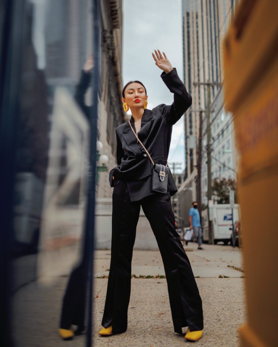 jessica wang wears yellow boots and a black suit while sharing how to make your winter outfits pop // Jessica Wang - Notjessfashion.com