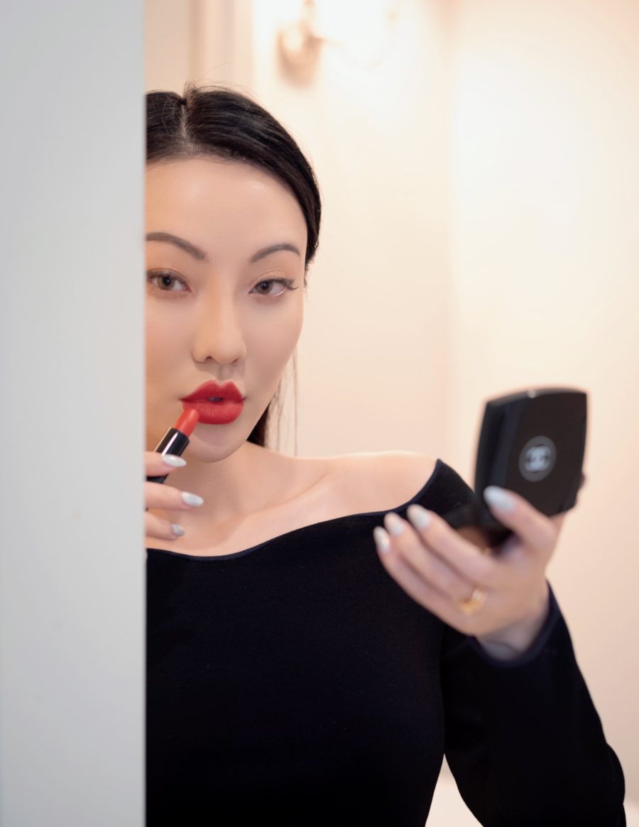 jessica wang wearing a black blouse putting on red lipstick while sharing her favorite beauty buys from the Nordstrom Anniversary Sale 2021 // Jessica Wang - Notjessfashion.com