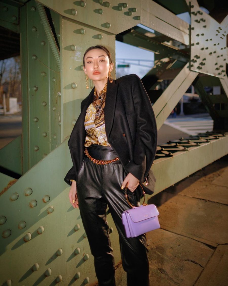 jessica wang wearing a black blazer with leather pants, a chain belt, and holding a lavender handbag while sharing spring accessories to wear for 2021, pastel handbags// Jessica Wang - Notjessfashion.com