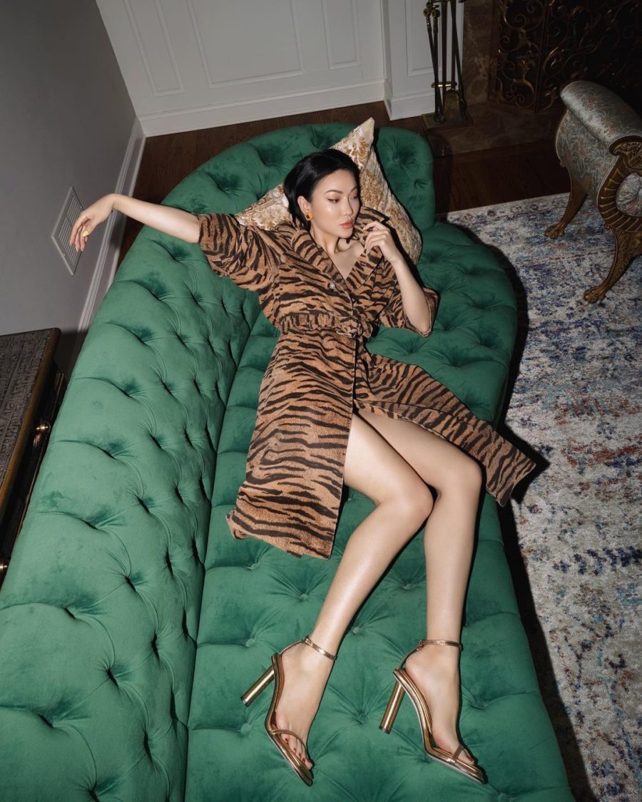 jessica wang wearing a Tiger stripe coat with tamara mellon heels while laying on stylish furniture // Jessica Wang - Notjessfashion.com