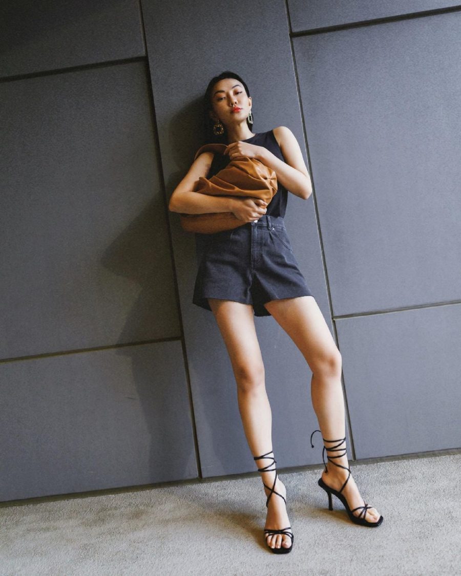 jessica wang wearing a black tank top and black shorts with strappy sandals while sharing night out outfits to wear this summer // Jessica Wang - Notjessfashion.com