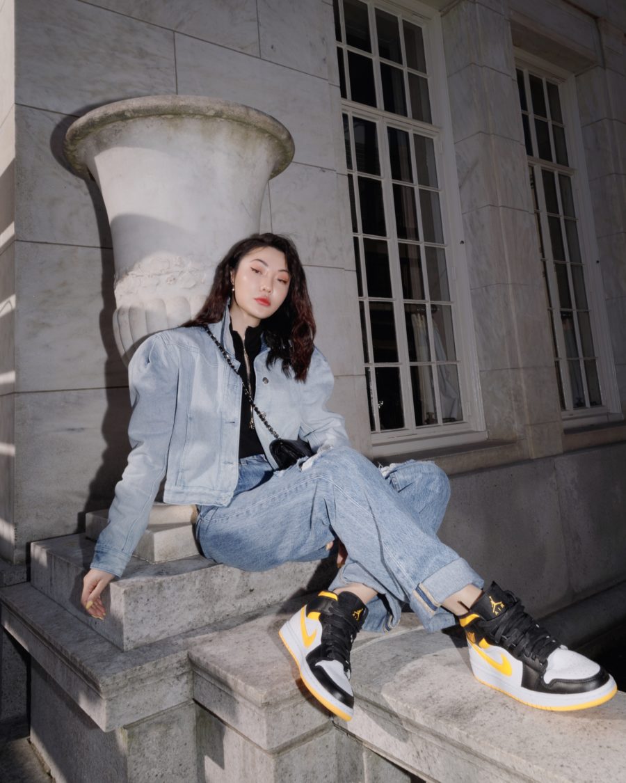 Jessica Wang wearing a denim jacket with distressed jeans and nike air jordans while sharing the best early black friday sales, pre-black friday deals // Jessica Wang - Notjessfashion.com