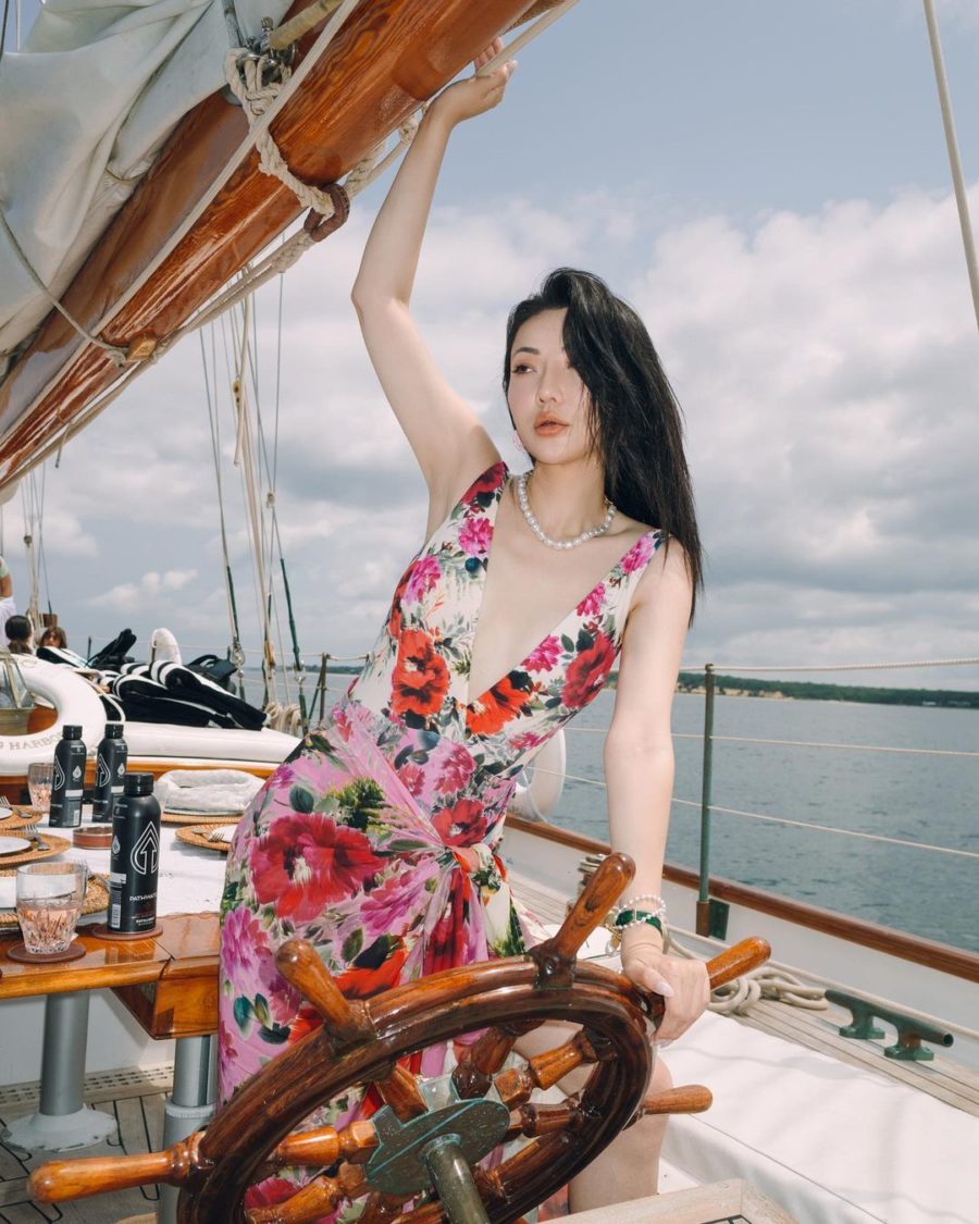 Jessica Wang wearing a floral one piece bikini with a floral sarong both featuring PQ while sharing her tips on becoming an influencer in 2021 // Jessica Wang - Notjessfashion.com