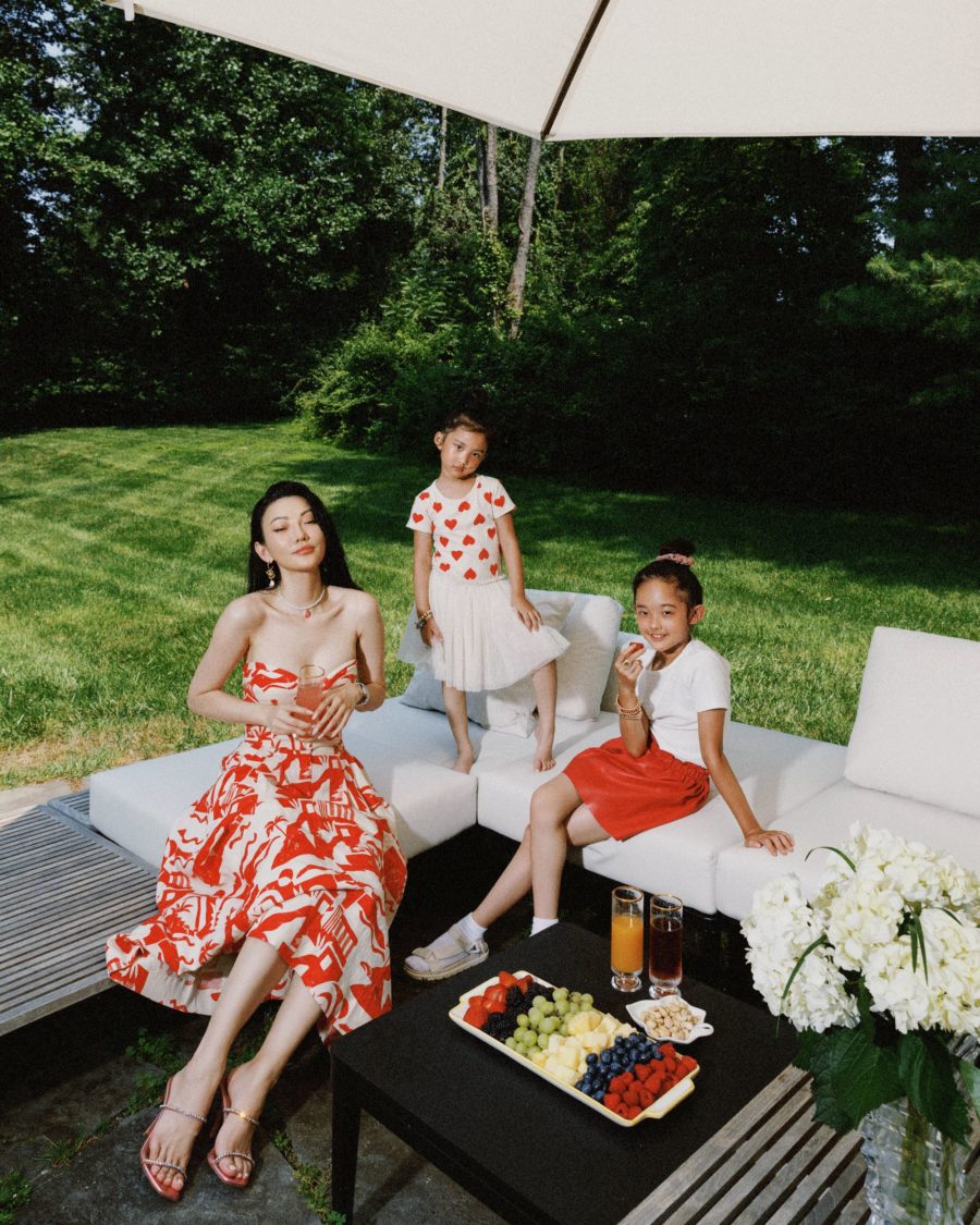jessica wang wearing a red and white printed strapless dress while sharing the coziest airbnb rentals in upstate new york // Jessica Wang - Notjessfashion.com