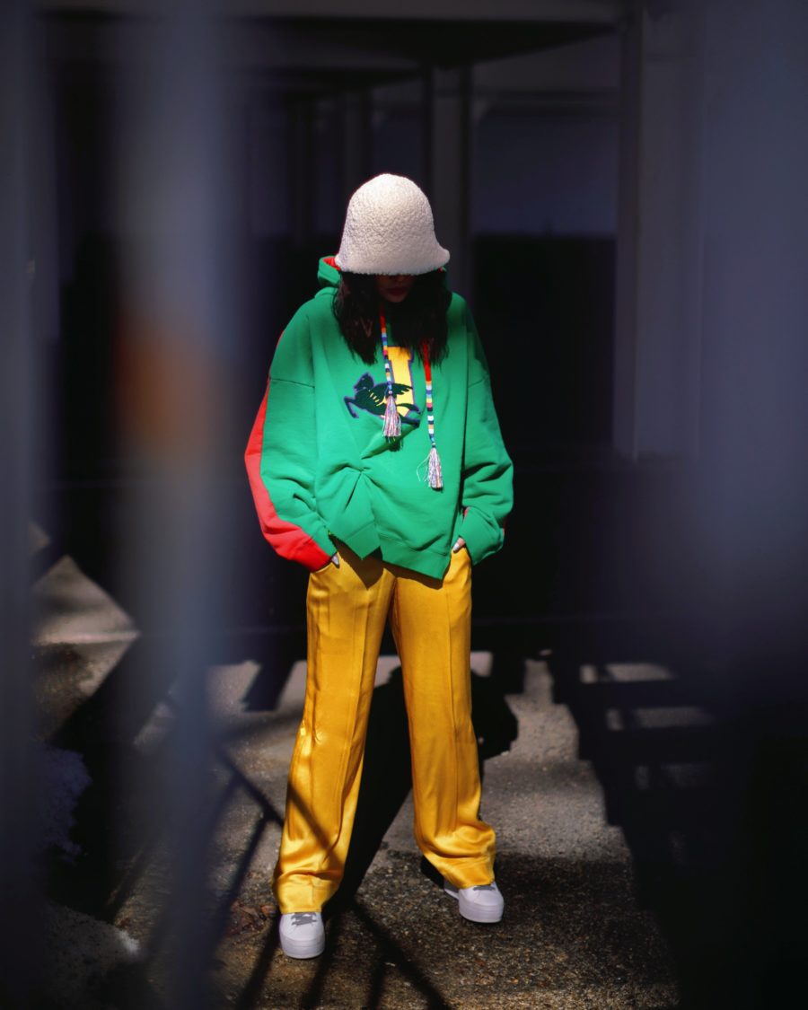 Jessica Wang wearing chic wardrobe staples featuring an oversized hoodie and yellow pants with neutral sneakers // Jessica Wang - Notjessfashion.com
