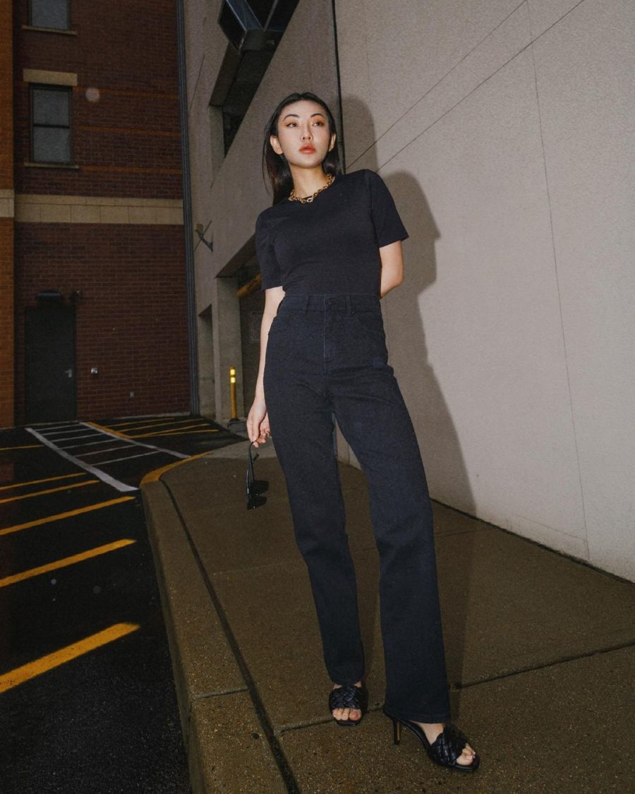 Jessica Wang wearing thanksgiving outfits featuring a black tee with loose jeans and braided sandals // Jessica Wang - Notjessfashion.com