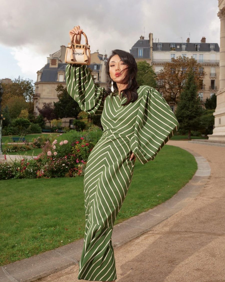 Jessica Wang wearing a green striped midi dress by ferragmo and carrying a mini bag while sharing affordable fashion stores // Jessica Wang - Notjessfashion.com