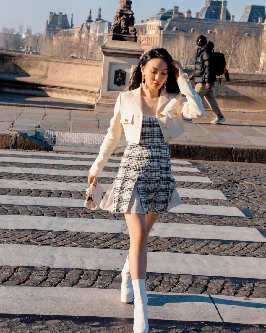 Jessica Wang wearing a cropped boucle blazer pleated mini dress and booties by giambattista valli while sharing her favorite 2022 resort trends // Jessica Wang - Notjessfashion.com